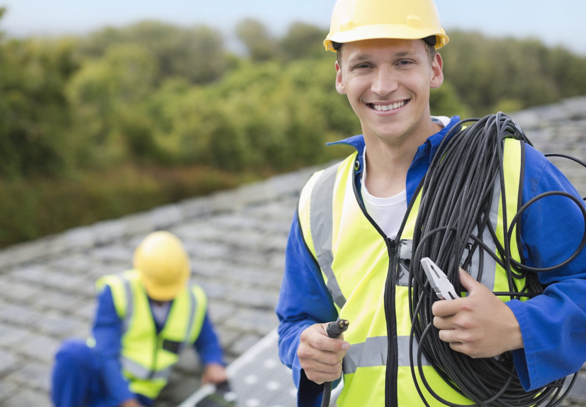 Worker smiling on rooftop